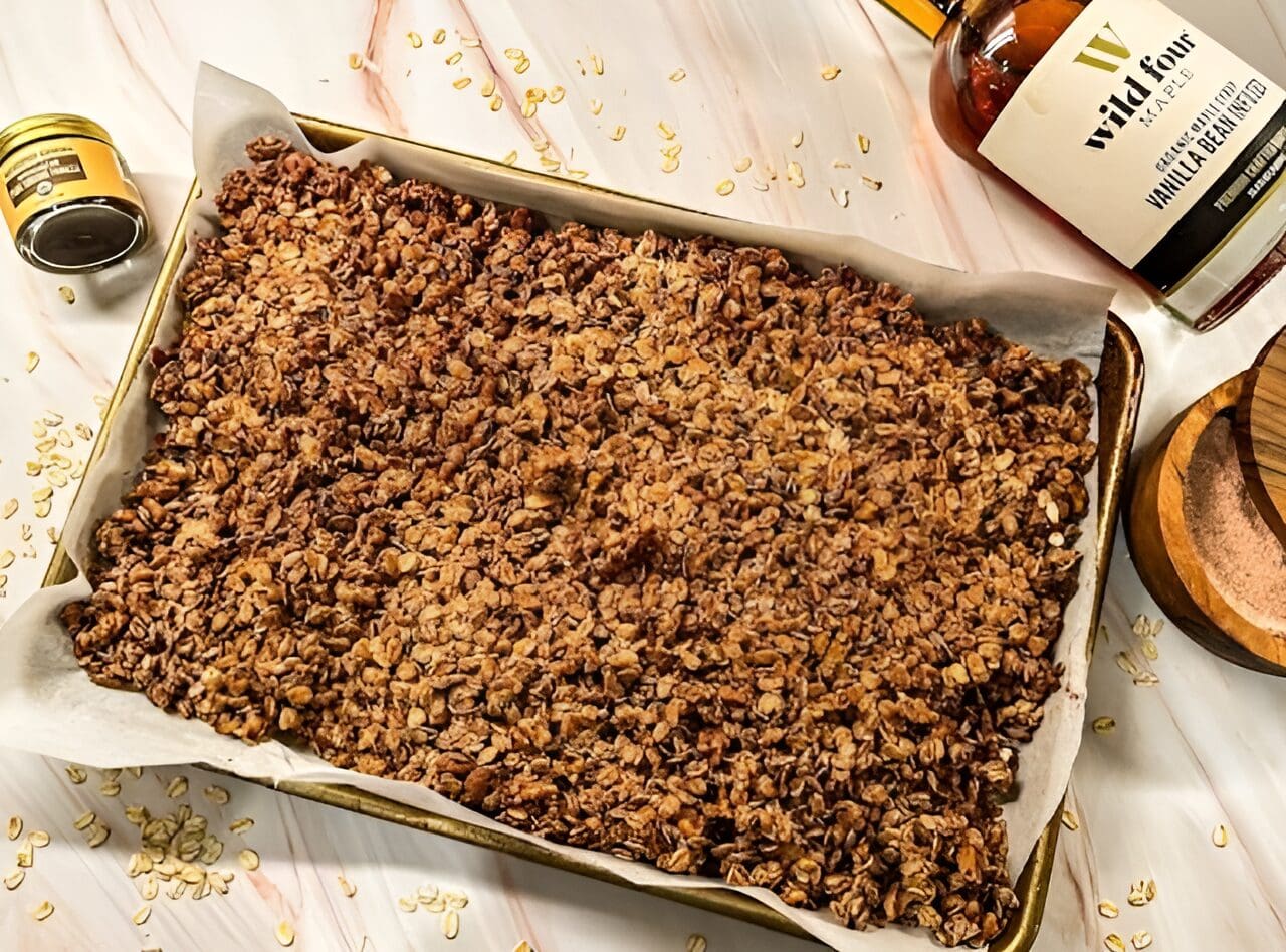 Homemade maple granola on baking sheet.