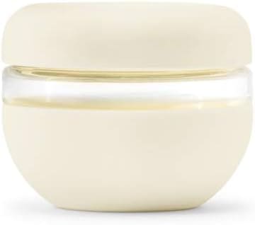 Here's an alt tag for the image: Cream-colored glass food storage container.