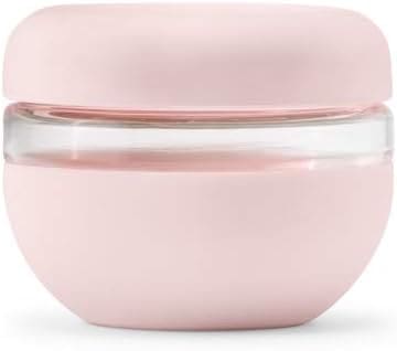 Here's an alt tag for the image: Pink glass food storage container.