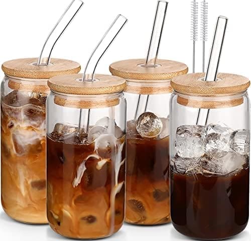 Four iced coffee drinks with straws.