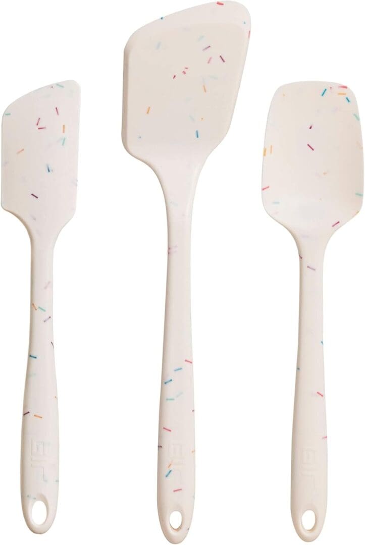 Here's an alt tag for the image: Three colorful silicone spatulas.