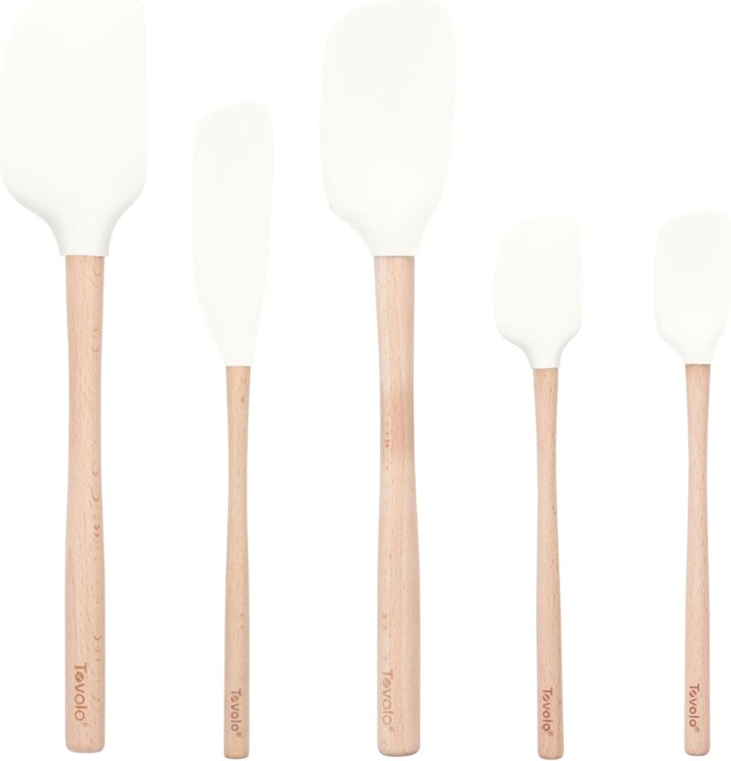 White silicone spatulas with wooden handles.