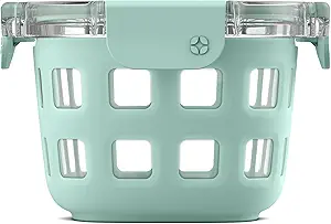 Here's an alt tag for the image: Mint green silicone food container with lid.