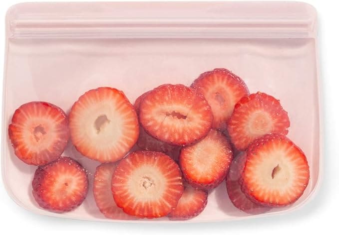 Pink reusable bag with sliced strawberries.