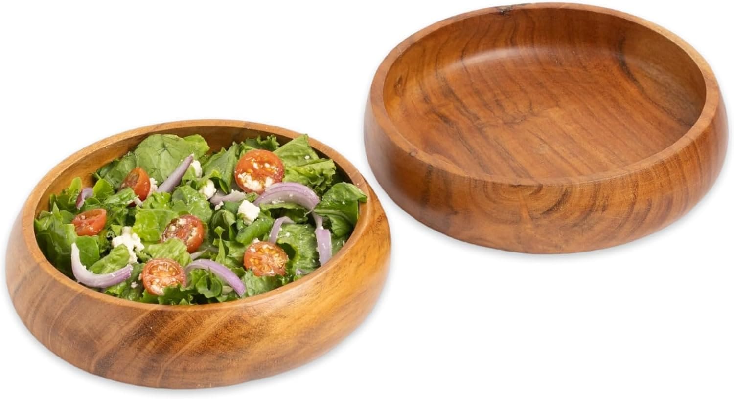 Wooden salad bowls with fresh salad.