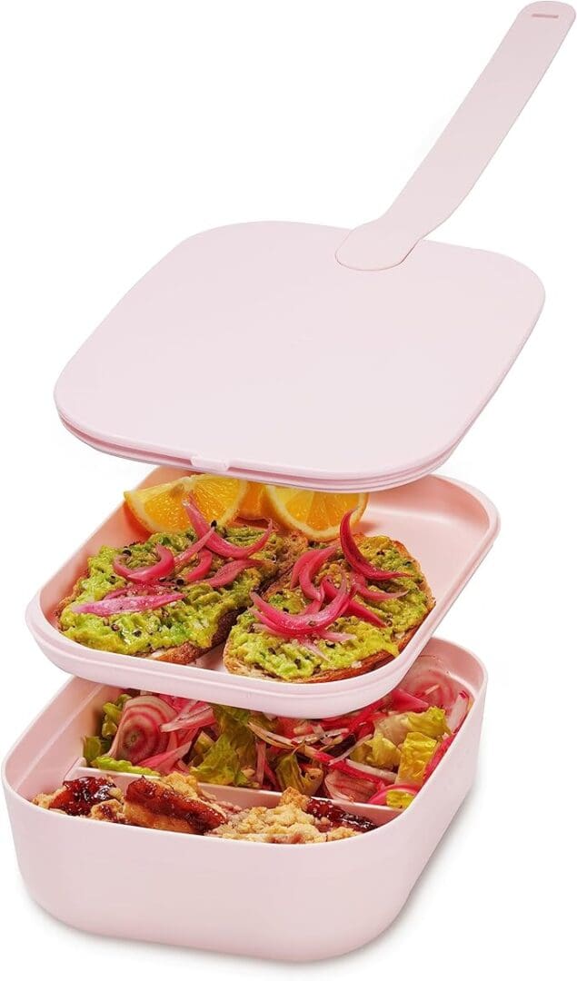 Pink bento box with avocado toast.