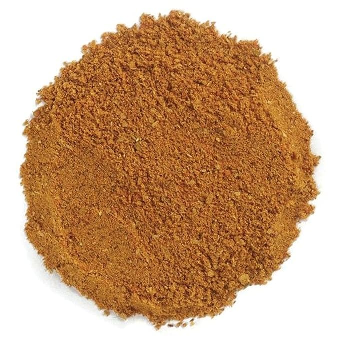 Pile of brown spice blend powder.