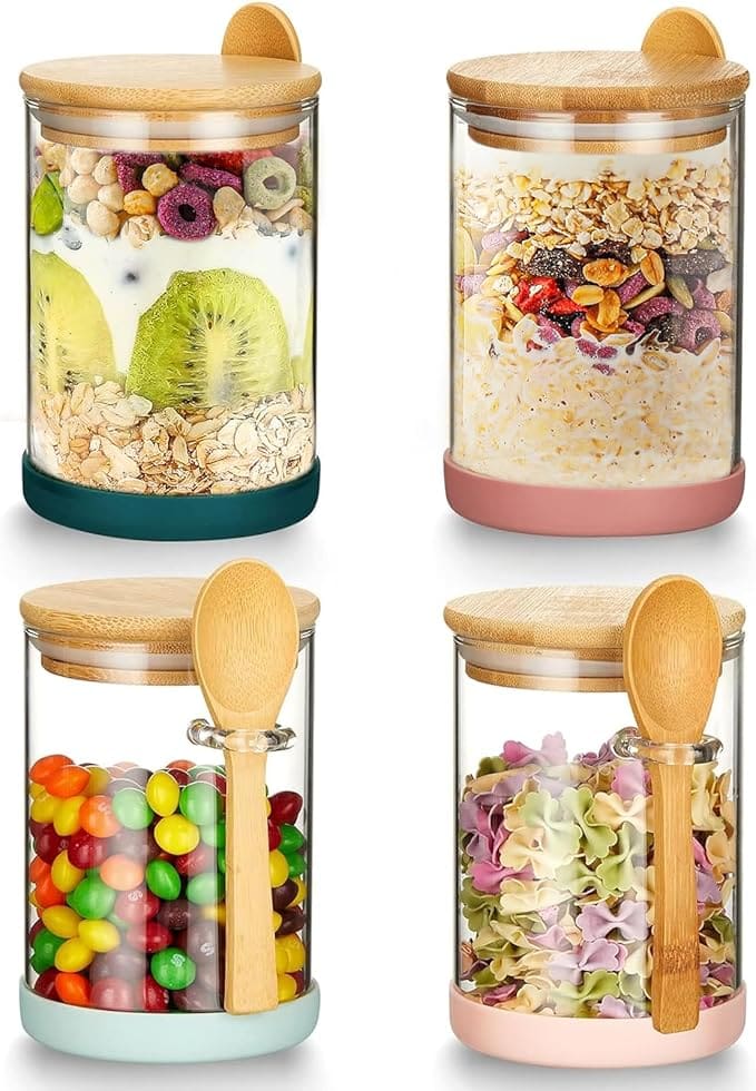 Four glass jars with various snacks.