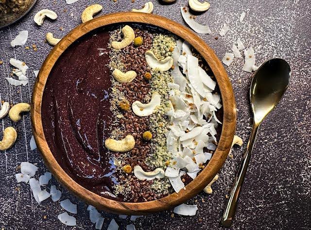 Acai bowl with cashews and coconut.