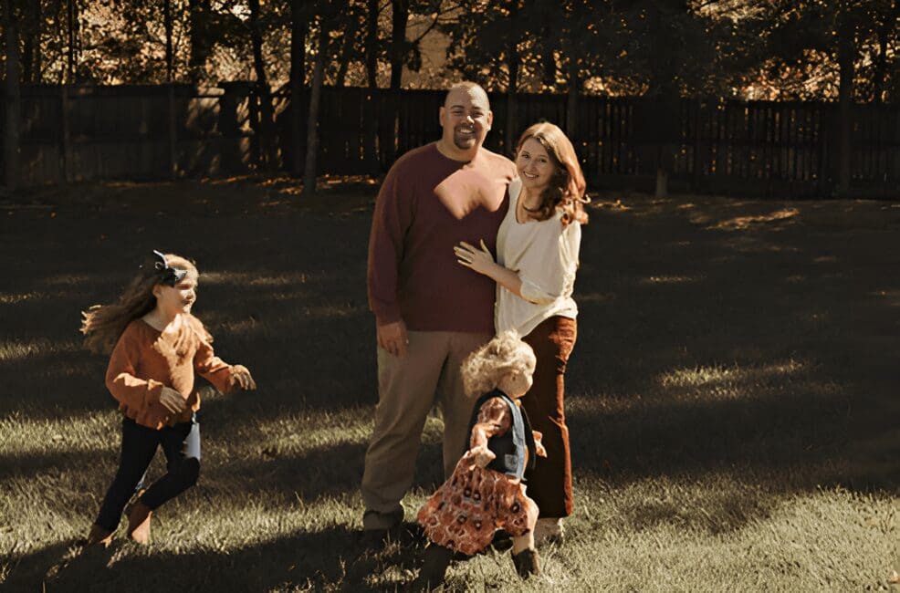 Family portrait in autumnal setting.